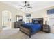 Comfortable bedroom with carpeted floors, ceiling fan, and classic furnishings at 28942 N Lazurite Way, San Tan Valley, AZ 85143