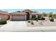 Charming single-Gathering home with desert landscaping, a tile roof, and a well-maintained front yard at 28942 N Lazurite Way, San Tan Valley, AZ 85143
