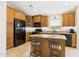 Well-appointed kitchen featuring an island, granite countertops, and modern appliances at 28942 N Lazurite Way, San Tan Valley, AZ 85143