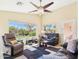 Bright living area with natural light, featuring plush seating and backyard views at 28942 N Lazurite Way, San Tan Valley, AZ 85143