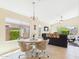 Inviting living space with large windows, tile flooring, and comfortable seating, offering a relaxing atmosphere at 28942 N Lazurite Way, San Tan Valley, AZ 85143