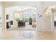 Inviting living room with tile flooring, arched doorways, and plenty of natural light at 28942 N Lazurite Way, San Tan Valley, AZ 85143