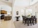 This open-concept space boasts a dining table that sits next to the open kitchen and living room at 28942 N Lazurite Way, San Tan Valley, AZ 85143