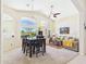 Open-concept space with a dining table, living area and large windows, perfect for entertaining at 28942 N Lazurite Way, San Tan Valley, AZ 85143