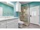 A well-lit bathroom offers a stylish vanity, a mirror, and a contemporary shower for a refreshing experience at 29756 N Varnum Rd, San Tan Valley, AZ 85143