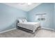 This cozy bedroom features a sloped ceiling and a stylish metal bed frame, creating a peaceful retreat at 29756 N Varnum Rd, San Tan Valley, AZ 85143