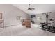 A bonus room provides recreation with a TV, exercise equipment, and comfortable seating under an airy ceiling at 29756 N Varnum Rd, San Tan Valley, AZ 85143