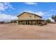 Exterior of unique building with sprawling yard, showcasing ample space and privacy at 29756 N Varnum Rd, San Tan Valley, AZ 85143