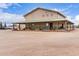 Property exterior showing the building and surrounding spacious land, ideal for outdoor activities at 29756 N Varnum Rd, San Tan Valley, AZ 85143