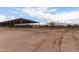 Large covered horse stall area with plenty of open space and desert landscape at 29756 N Varnum Rd, San Tan Valley, AZ 85143
