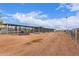 Spacious horse corrals with plenty of natural light create a comfortable environment for equestrian activities at 29756 N Varnum Rd, San Tan Valley, AZ 85143