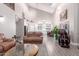 Open-concept living room and kitchen boasts high ceilings and lots of natural light at 29756 N Varnum Rd, San Tan Valley, AZ 85143