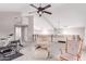 A spacious loft includes chairs, exercise equipment, and a rail overlooking a large room below at 29756 N Varnum Rd, San Tan Valley, AZ 85143