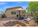 Landscaped backyard with rocks, gravel, a cozy seating area, and a BBQ, ideal for outdoor gatherings and relaxation at 30430 N 42Nd Pl, Cave Creek, AZ 85331