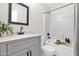 Clean bathroom showcases a single sink vanity and tub with shower at 30430 N 42Nd Pl, Cave Creek, AZ 85331