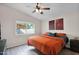 Cozy bedroom with vaulted ceiling, ceiling fan, and a view of the backyard at 30430 N 42Nd Pl, Cave Creek, AZ 85331