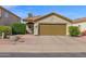 Inviting home exterior featuring a well-manicured lawn, beautiful landscaping, and a two-car garage, ideal for a Gathering at 30430 N 42Nd Pl, Cave Creek, AZ 85331