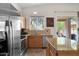 Well-equipped kitchen with a view to the backyard, granite countertops, and stainless appliances at 30430 N 42Nd Pl, Cave Creek, AZ 85331