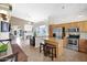 Kitchen and living area in an open floor plan with stainless appliances and breakfast bar at 30430 N 42Nd Pl, Cave Creek, AZ 85331