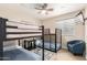 bedroom featuring a bunk bed with guardrails, ceiling fan, and hardwood flooring at 3209 E Marilyn Rd, Phoenix, AZ 85032