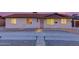 Charming single-story home showcasing a well-maintained front yard and exterior lighting at 3209 E Marilyn Rd, Phoenix, AZ 85032