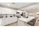 Modern kitchen featuring white cabinets, quartz countertops, and stainless steel appliances at 3209 E Marilyn Rd, Phoenix, AZ 85032