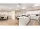 Bright, open-concept kitchen showcasing a large island, white cabinetry, and modern appliances at 3209 E Marilyn Rd, Phoenix, AZ 85032