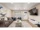 Spacious living room with comfortable seating, modern decor, and a large television at 3209 E Marilyn Rd, Phoenix, AZ 85032