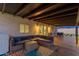 Covered patio with a blue sectional and a dining area for outdoor entertaining at 3209 E Marilyn Rd, Phoenix, AZ 85032