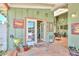Inviting back porch with tiled flooring, French doors to the pool, and charming decorative accents at 3328 S Stanley Pl, Tempe, AZ 85282