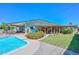 Spacious backyard with a sparkling pool, lush landscaping, and shaded patio at 3328 S Stanley Pl, Tempe, AZ 85282
