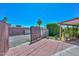 Spacious backyard featuring brick-paved area, secure gated access, and mature landscaping for private enjoyment at 3328 S Stanley Pl, Tempe, AZ 85282