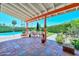 Expansive outdoor patio with a dining area, pool view, and beautiful landscaping at 3328 S Stanley Pl, Tempe, AZ 85282
