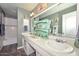 Charming bathroom featuring dual sinks, neutral countertops, and tiled shower-tub at 3328 S Stanley Pl, Tempe, AZ 85282