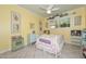 Bright bedroom with colorful decor, cheerful yellow walls, and a sweet 'Sweet Dreams' headboard at 3328 S Stanley Pl, Tempe, AZ 85282