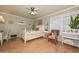 Comfortable bedroom featuring natural light, a ceiling fan, and a cozy armchair at 3328 S Stanley Pl, Tempe, AZ 85282