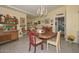 Charming dining room with a chandelier, tiled floors, and ample room for entertaining at 3328 S Stanley Pl, Tempe, AZ 85282