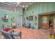 Inviting covered entryway with colorful decor, tiled floor, and comfortable seating at 3328 S Stanley Pl, Tempe, AZ 85282