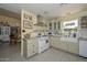 Charming kitchen featuring a vintage stove, a farmhouse sink, and colorful decor at 3328 S Stanley Pl, Tempe, AZ 85282
