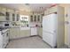 Bright and airy kitchen featuring white appliances, tiled floors, and ample counter space at 3328 S Stanley Pl, Tempe, AZ 85282