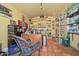 Spacious home office featuring built-in shelving, tile floors, and ample storage for organized productivity at 3328 S Stanley Pl, Tempe, AZ 85282