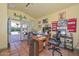 Bright home office with a view to the pool area, built-in shelving, and a functional workspace at 3328 S Stanley Pl, Tempe, AZ 85282