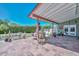 Charming covered patio with tiled flooring, outdoor dining set, and lush garden views at 3328 S Stanley Pl, Tempe, AZ 85282