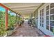 Inviting covered patio with tiled flooring, plants, and comfortable seating arrangement at 3328 S Stanley Pl, Tempe, AZ 85282