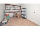 Functional storage room with lots of shelving and tile flooring at 3328 S Stanley Pl, Tempe, AZ 85282