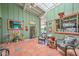 Bright sunroom featuring decorative accents, comfortable seating, and views of the outdoor garden at 3328 S Stanley Pl, Tempe, AZ 85282