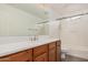 Bathroom featuring wood cabinets, large mirror and shower at 3591 S Ranger Trl, Gilbert, AZ 85297