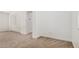 Bright bedroom features neutral carpet, white walls, and an arched entrance to a storage room at 3591 S Ranger Trl, Gilbert, AZ 85297