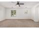 Bright bedroom features carpet, recessed lighting, and a large window providing ample natural light at 3591 S Ranger Trl, Gilbert, AZ 85297