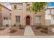 Charming two-story home with a warm beige exterior, arched entry, and well-maintained front yard at 3591 S Ranger Trl, Gilbert, AZ 85297